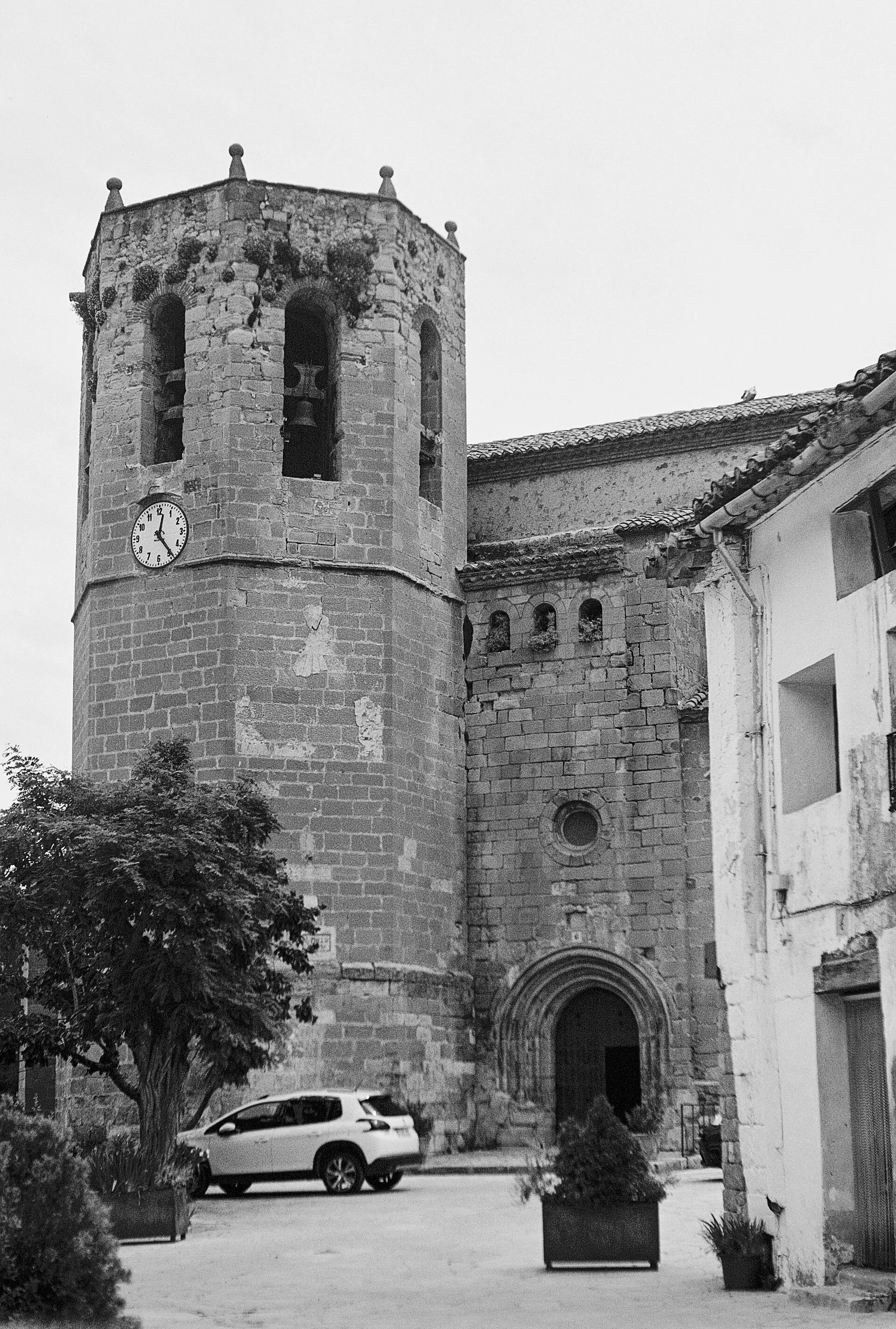 Stone church bell tower in a small town square