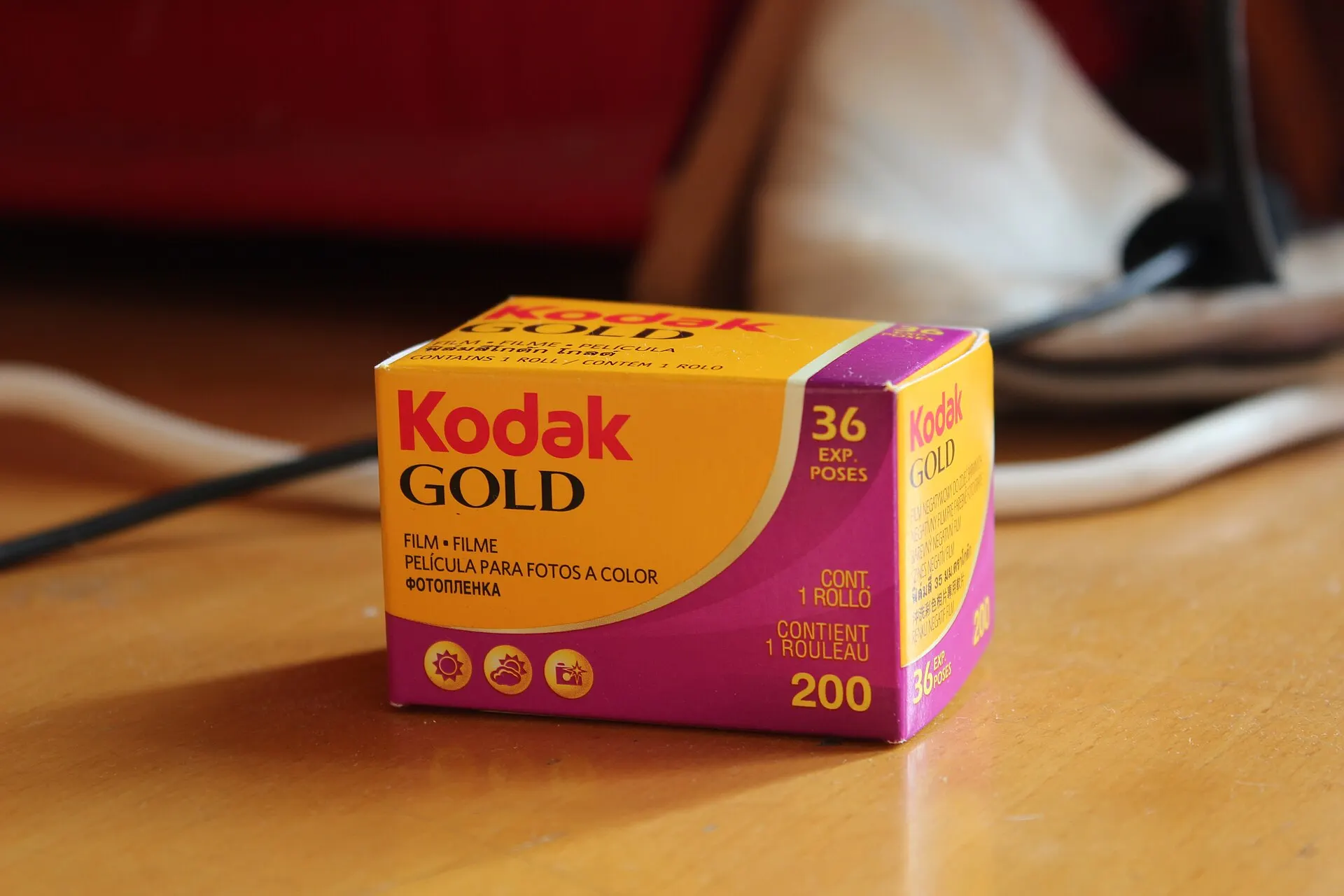 Kodak Gold 200 box of 36-exposure 35mm film on a wooden table