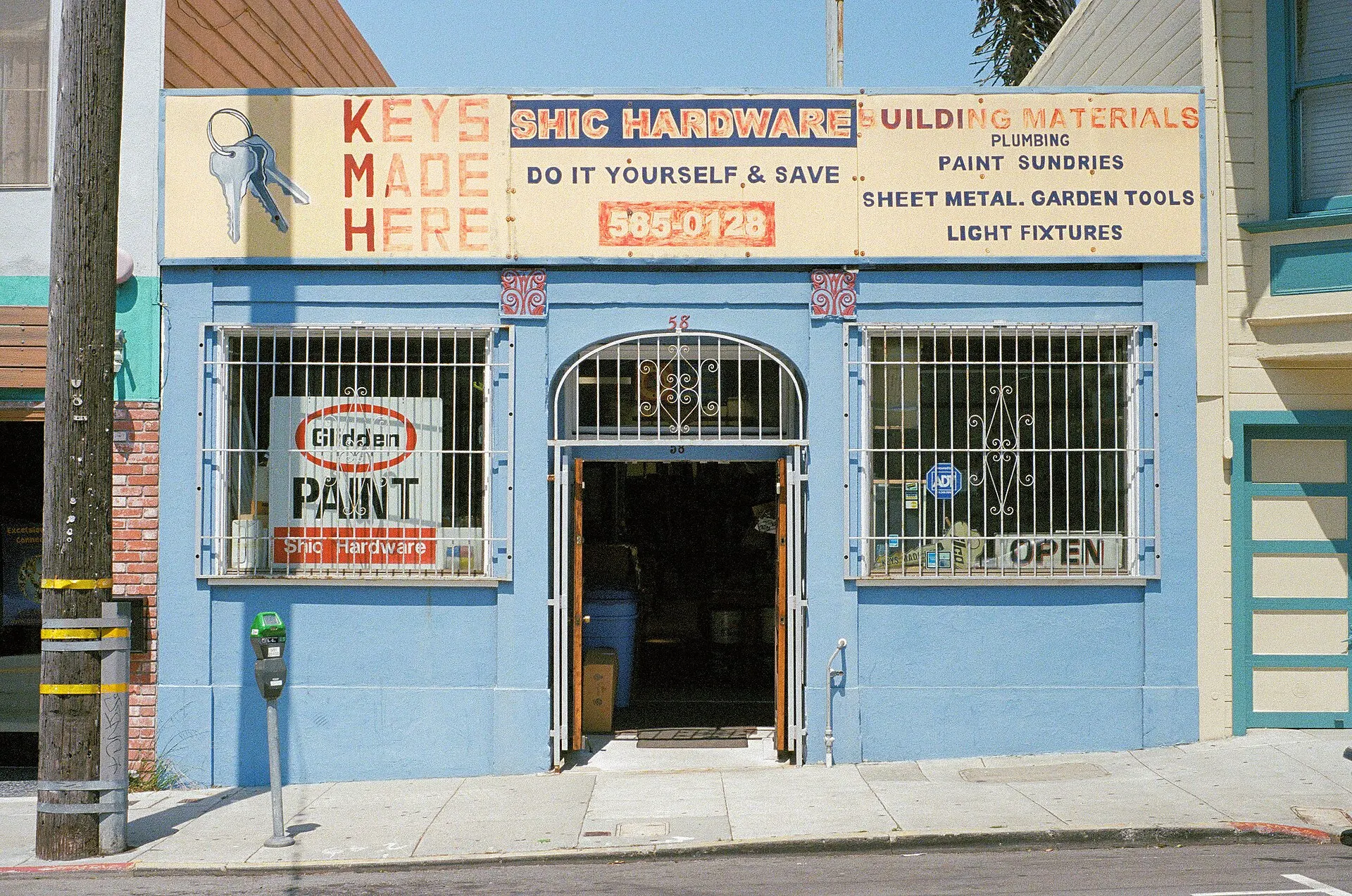 Blue storefront of Shic Hardware on Ocean Avenue in San Francisco, photographed on Lomography Color Negative 400