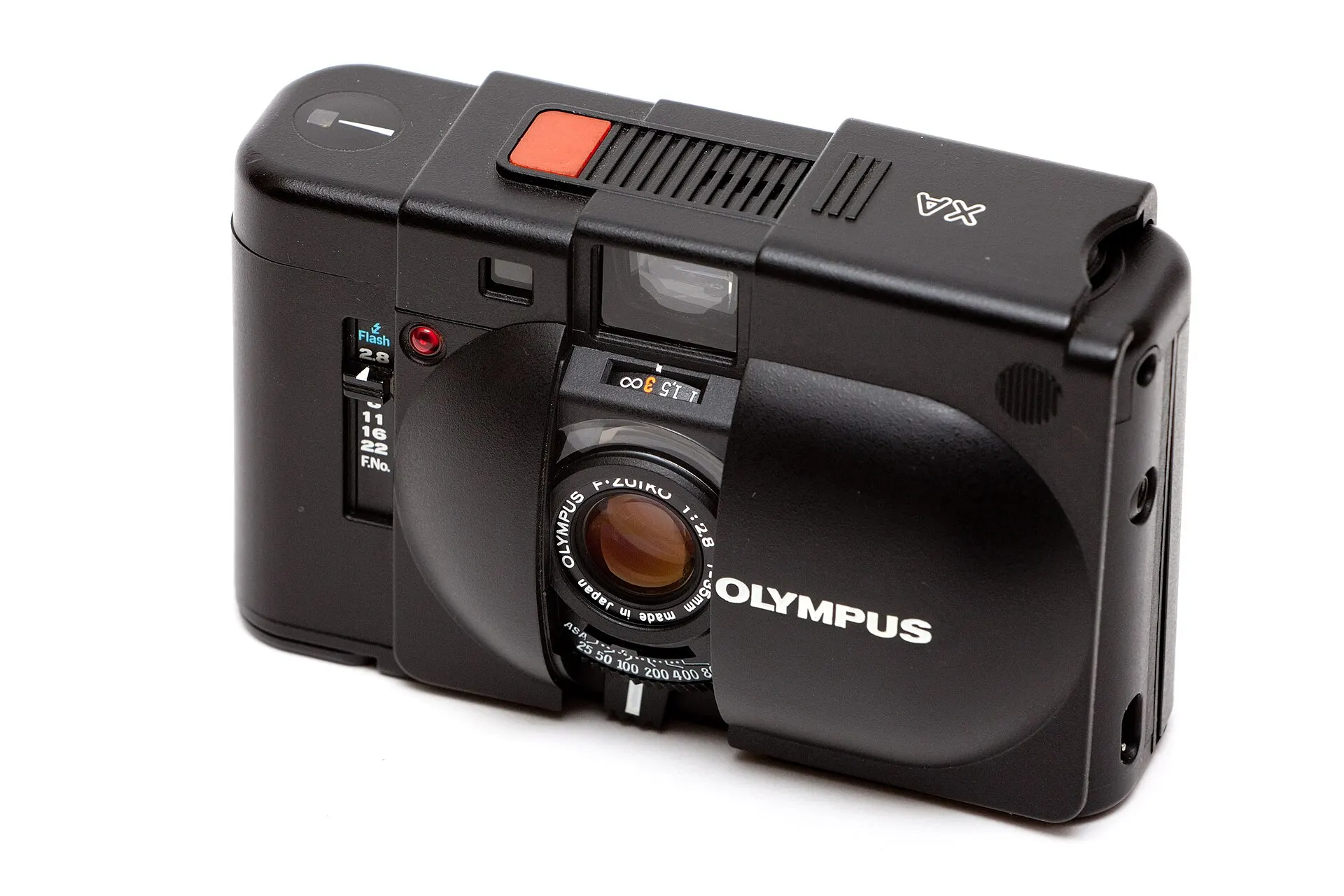 Black Olympus XA with its clamshell cover slid open, showing the F.Zuiko lens, the red shutter button and the rangefinder windows