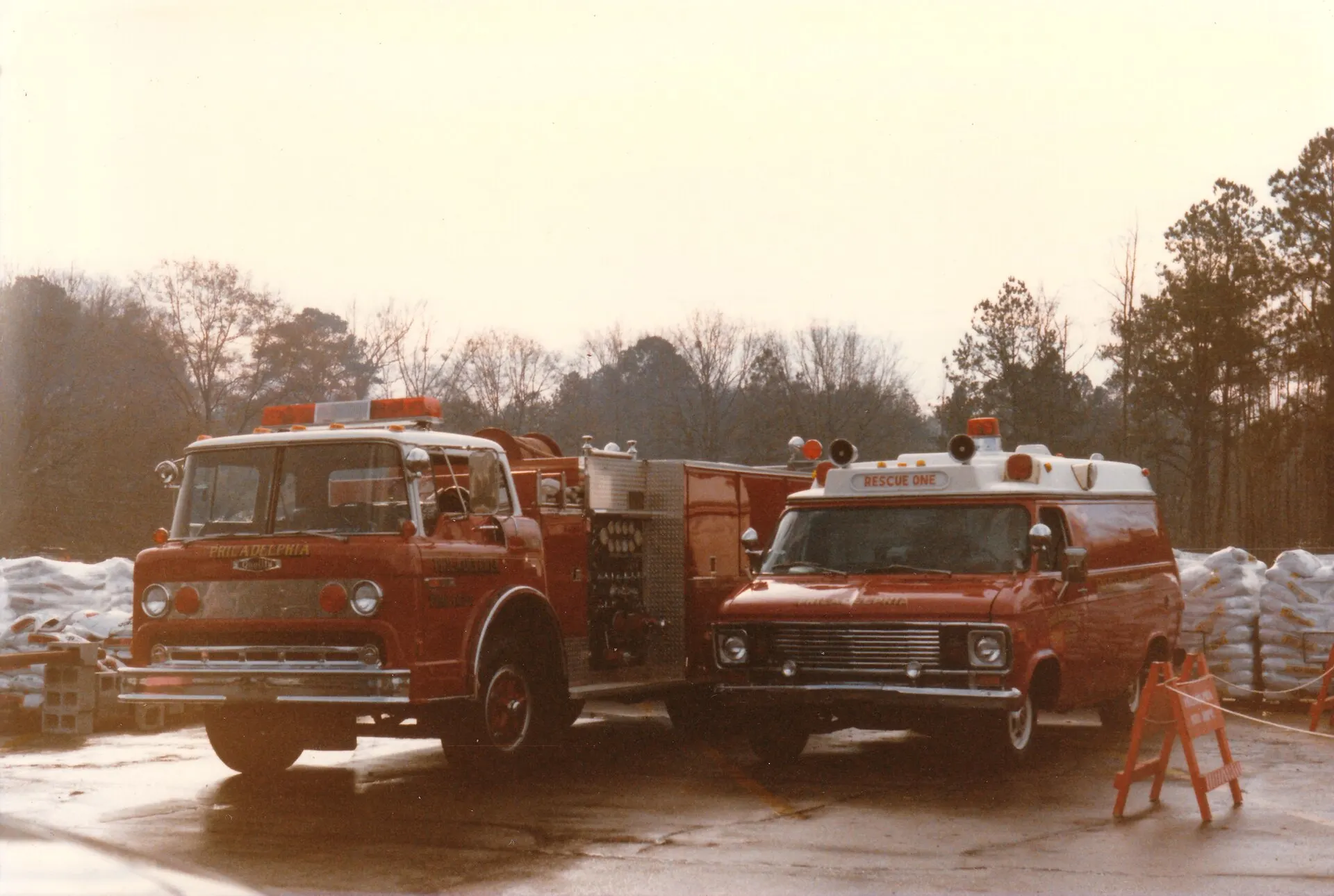 Two red Philadelphia Fire Department trucks parked side by side
